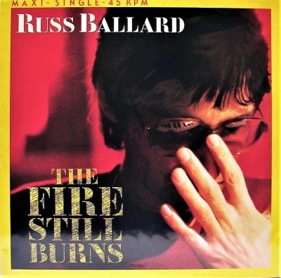 The Fire Still Burns - Russ Ballard (Winyl, 12", 45 RPM, Maxi-Singiel, ℗ © 1985 Niemcy, EMI #1C K 060 20 0694 6) - przód główny