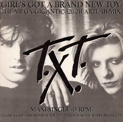 Girl's Got A Brand New Toy (The Mega-Gigantic-120 dB Artlab-Mix) - T.X.T. (Winyl, 12", 45 RPM, Maxi-Singiel, Czerwone etykiety, ℗ © 1985 Niemcy, CBS #A 14.6073, CBSA 14.6073) - przód główny