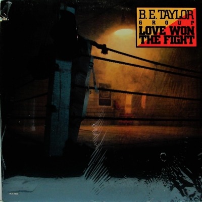 Love Won The Fight - B.E. Taylor Group (Winyl, LP, Album, ℗ © 1983 Stany Zjednoczone, MCA Records, Sweet City Records #MCA-39007) - przód główny