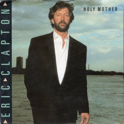 Holy Mother - Eric Clapton (Winyl, 7", 45 RPM, Singiel, Silver Injection Labels, ℗ © Lis 1987 Wielka Brytania, Warner Bros. Records, Duck Records #W8141, 928 141-7, W 8141) - przód główny