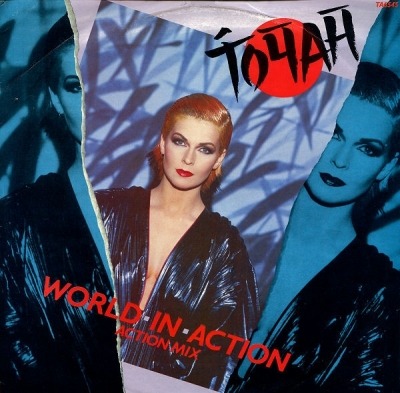 World In Action (Action Mix) - Toyah (Winyl, 12", 45 RPM, Singiel, ℗ © 21 Wrz 1985 Wielka Brytania, Portrait #TA 6545, TA6545) - przód główny