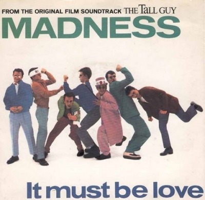 It Must Be Love / The Return Of The Los Palmas 7 - Madness (Winyl, 7", Singiel, ℗ © 1989 Wielka Brytania, Virgin #VS 1197) - przód główny